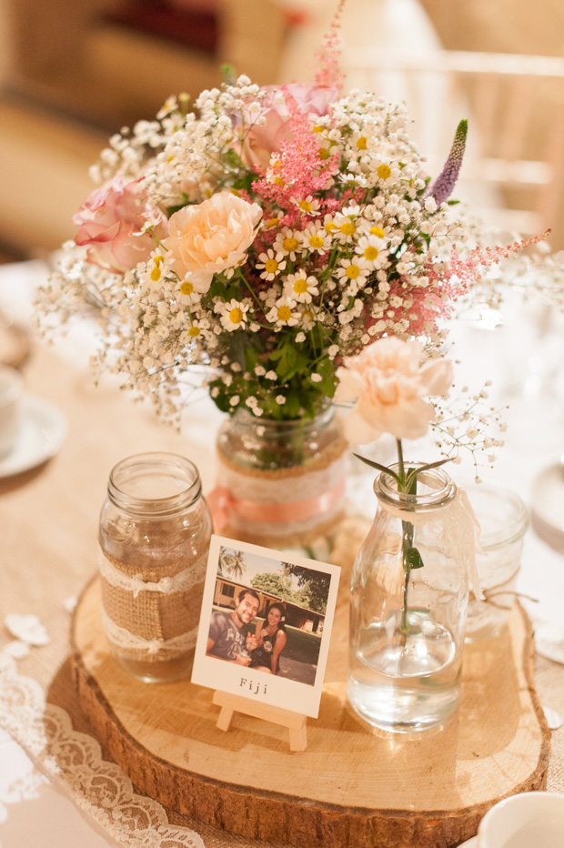 Pastel rustic table centrepieces | Paul and Ann's pretty barn wedding at Larchfield | onefabday.com