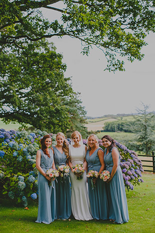 pastel blue bridesmaids dresses | Olly and Annie's pretty summer wedding by Gather and Tides | onefabday.com