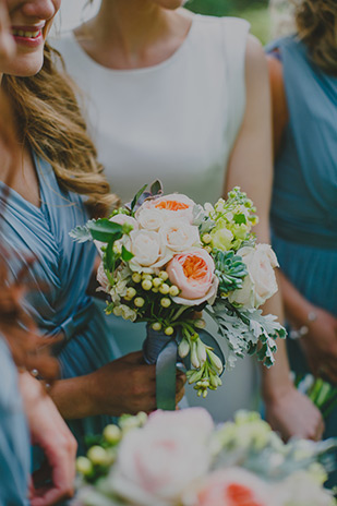 pastel blue bridesmaids dresses | Olly and Annie's pretty summer wedding by Gather and Tides | onefabday.com