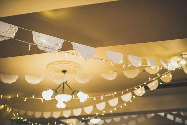 doily bunting | Elaine and Kenny's pretty pastel pub wedding by Paula Gillespie | onefabday.com