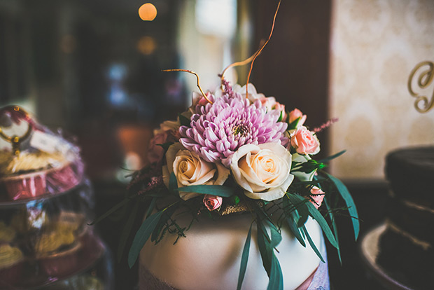 pretty ceremony florals | Elaine and Kenny's pretty pastel pub wedding by Paula Gillespie | onefabday.com