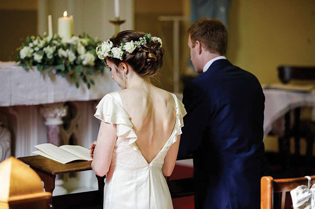 The beautiful Orlaith with a floral hair garland | Orlaith and Sean's Pretty Clonwilliam House Wedding by Corrine Crennan | onefabday.com