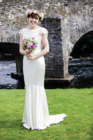 The beautiful Orlaith with a floral hair garland | Orlaith and Sean's Pretty Clonwilliam House Wedding by Corrine Crennan | onefabday.com