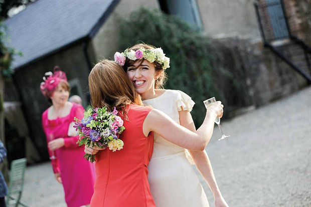 The beautiful Orlaith with a floral hair garland | Orlaith and Sean's Pretty Clonwilliam House Wedding by Corrine Crennan | onefabday.com