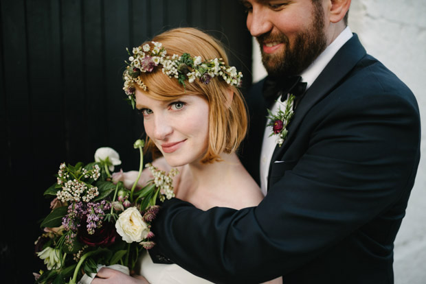 bride with floral garland and pretty bouquet by The Informal Florist | Mackenzie and Derby's Beautiful Dublin City Wedding at House by Simple Tapestry | see the full wedding at onefabday.com