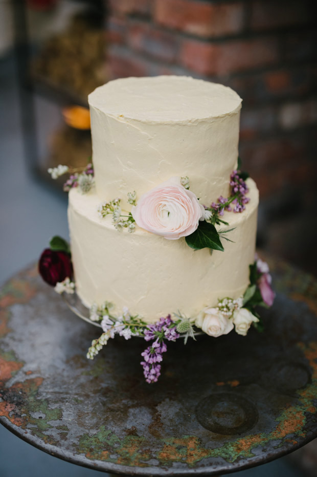 soft iced wedding cake with simple blooms | Mackenzie and Derby's Beautiful Dublin City Wedding at House by Simple Tapestry | see the full wedding at onefabday.com