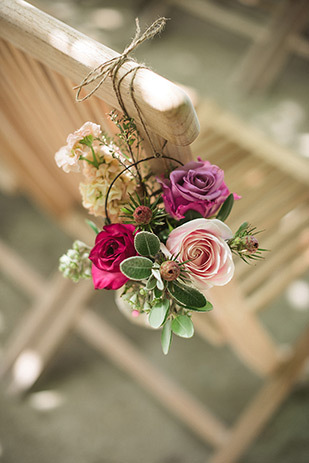 Hanging ceremony floral chair decor | Maria and Mark's pretty in pink and floral wedding by Meridith Lord Photography | onefabday.com