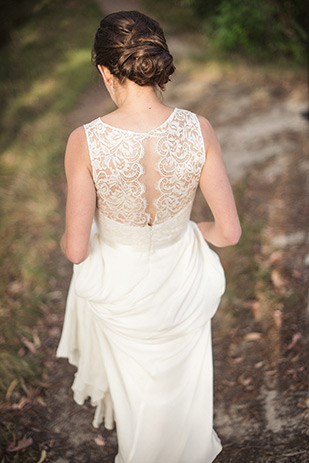 Lace back detail dress | Maria and Mark's pretty in pink and floral wedding by Meridith Lord Photography | onefabday.com