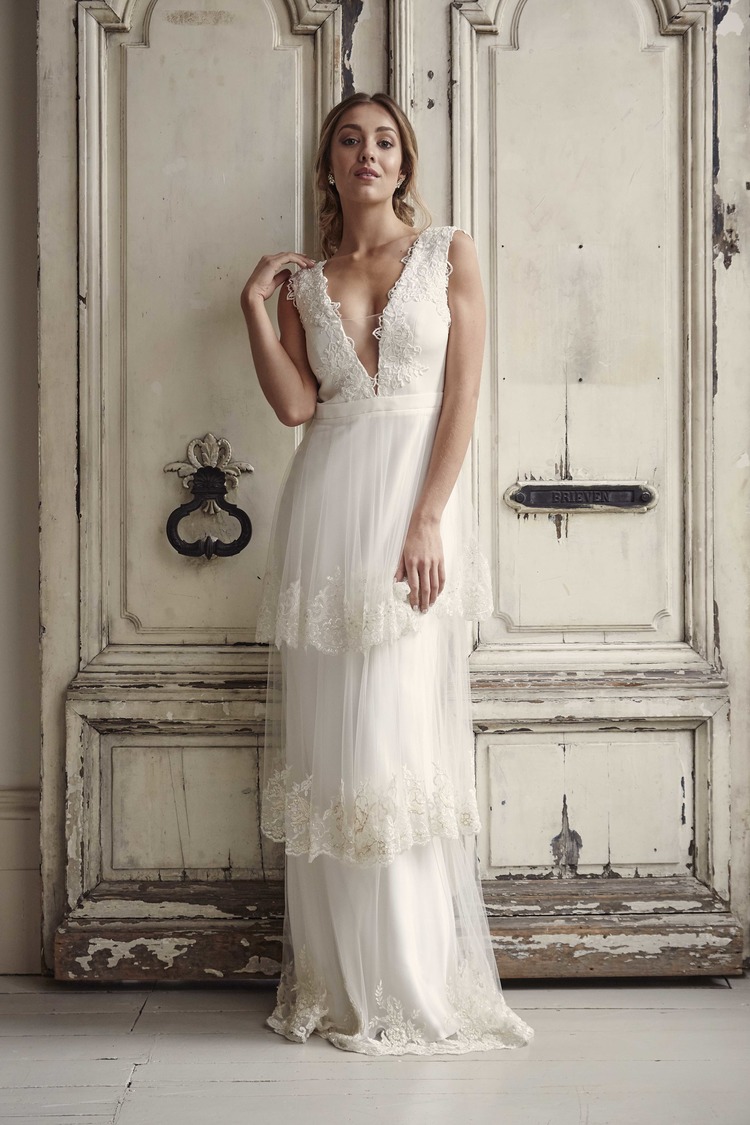 Laura from Savin London wedding dresses 2016 - Stunning v-neckline with detailed lace around the trim & sheer panel in the v. The edges have a delicate lace detailing - see the rest of the collection on onefabday.com