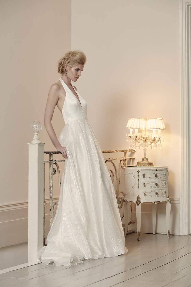 Camille from Savin London wedding dresses 2016 - Stunning halter neckline with a slight v in the centre which has a sheer panel. Nipped at the waist with a full skirt- see the rest of the collection on onefabday.com