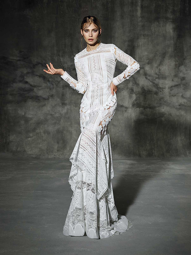 Rocafort from Yoaln Cris  wedding dresses 2016 -Pure white long sleeved wedding dress made by mixing macramé laces and white silk flowers. An orginal and very modern wedding dress. -  see the rest of the collection on onefabday.com