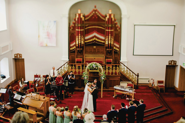 Flower-filled marquee Mussenden temple wedding in Ireland by NavyBlur Photography // onefabday.com