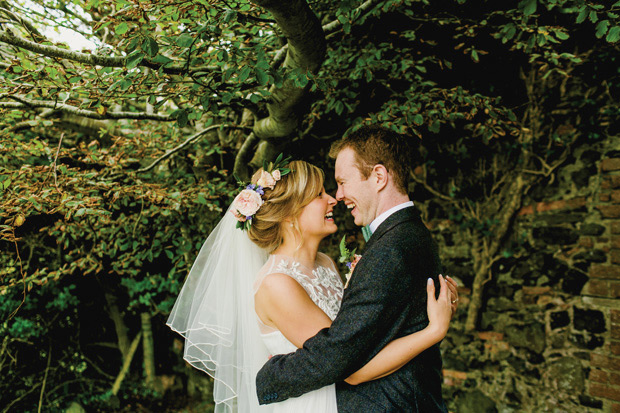 Flower-filled marquee Mussenden temple wedding in Ireland by NavyBlur Photography // onefabday.com