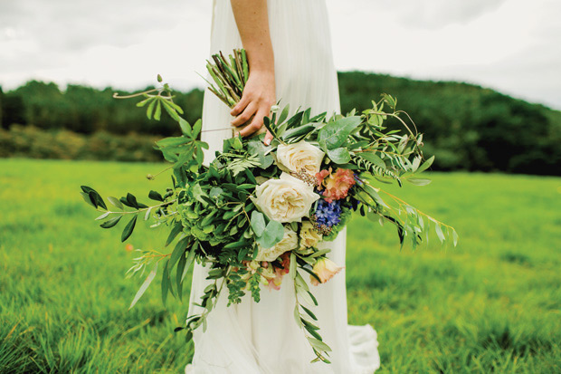 Flower-filled marquee Mussenden temple wedding in Ireland by NavyBlur Photography // onefabday.com