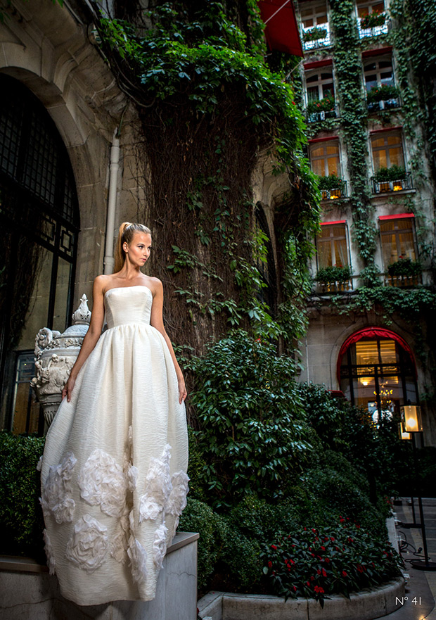 #41 from Celestina Agostino wedding dresses 2016- Strapless bodice with an a-line full bodied tulip skirt. Large tattoed flowers on the end of the dress.  -  see the rest of the collection on onefabday.com