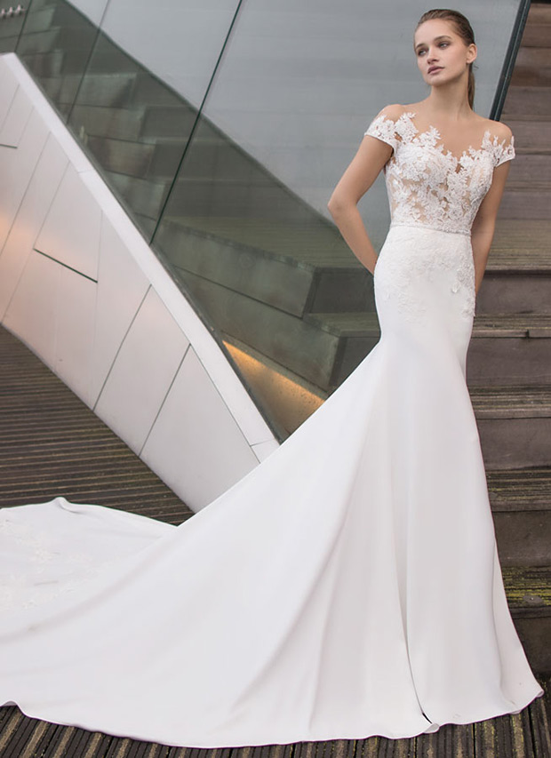 Beth from Modeca wedding dresses 2018 - Off the shoulder floral applique,floral lace detailing down the skirt. Trumpet style skirt.-  see the rest of the collection on onefabday.com