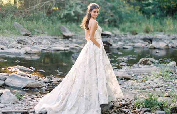 Karina from Rebecca Schoneveld wedding dresses 2017 -Fitted bodice with shoe string straps. Natural waist line with full ball gown skirt. Floral pattern throughout the dress - see the rest of the collection on onefabday-com.go-vip.net