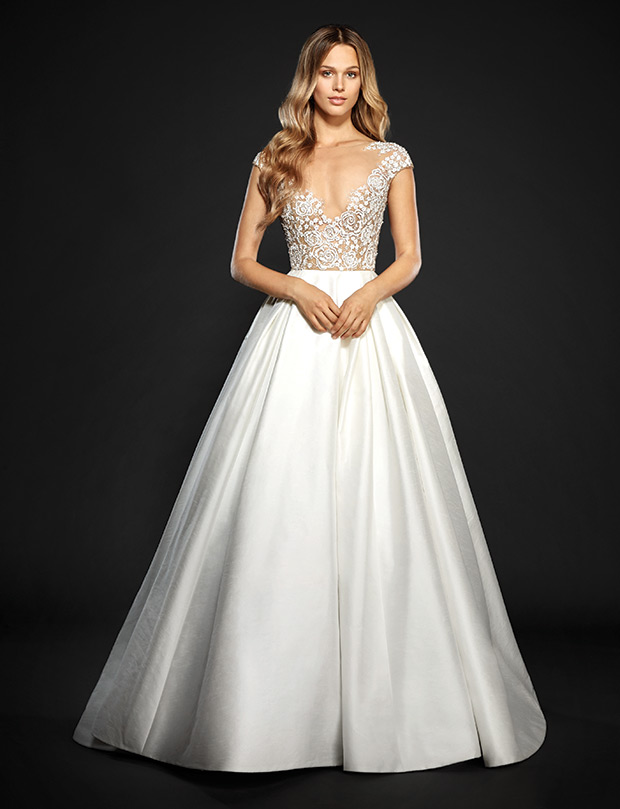 Chandler from Hayley Paige wedding dresses Spring 2017 - Bateau illusion neckline with a v-neckline. Embroidered bodice and cap sleeve. Dupioni  skirt.-  see the rest of the collection on onefabday.com