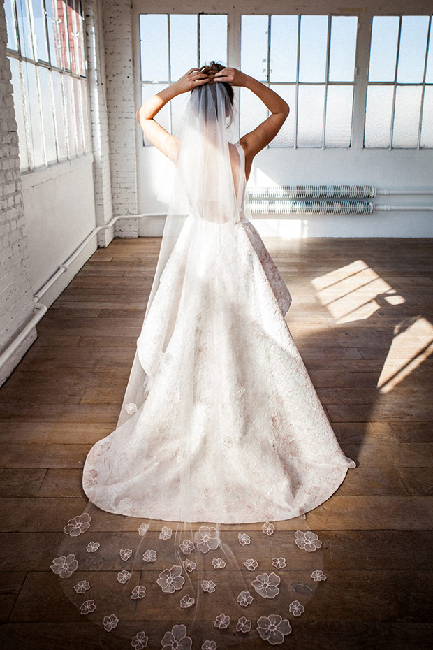 Henrietta from Meryl Suissa wedding dresses 2017 - Deep open back with a high low hem skirt. Long train with a floral lace detailing.-  see the rest of the collection on onefabday.com