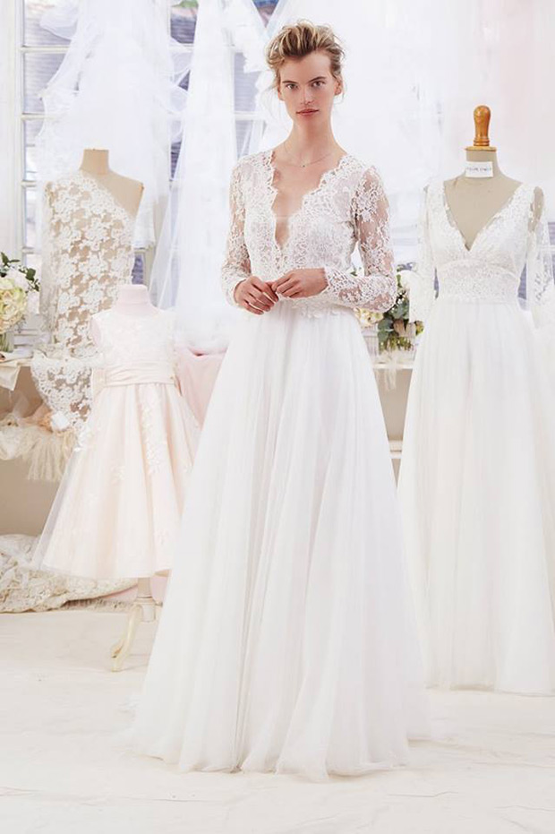 Avana Gown from Atelier Emelia wedding dresses 2018 - Layered tulle skirt with a deep v-neck line and long sleeves in Calais lace.-  see the rest of the collection on onefabday.com