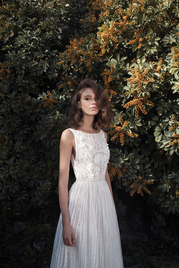 Abbi from Flora wedding dresses 2018 - Boat neck sleeveless straps, natural waist line. Embroidered floral detailing throughout -  see the rest of the collection on onefabday.com