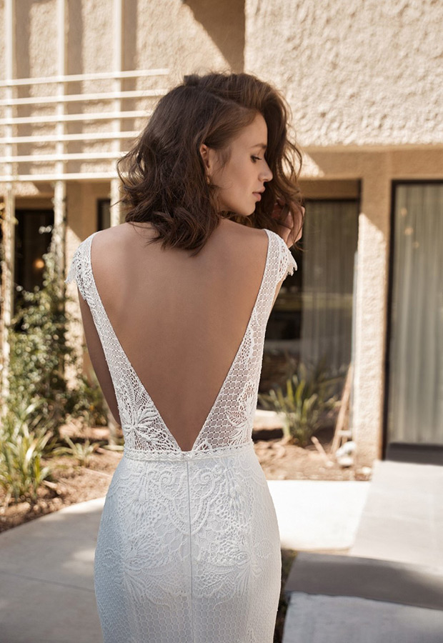 Julia from Flora wedding dresses 2018 - Deep v-open back with a sheer bodice with an overlay of lace detailing. Fitted skirt with delicate beading. -  see the rest of the collection on onefabday.com