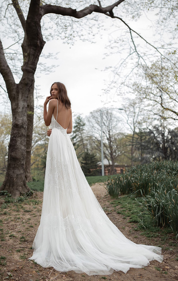 Lillian from Flora wedding dresses 2018 - Bodice in a low v-open back and shoe string straps. Sheer layered skirt with lace paneling.-  see the rest of the collection on onefabday.com