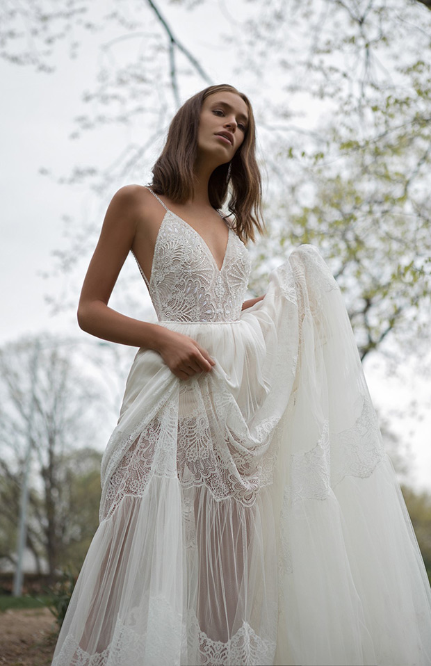 Lillian from Flora wedding dresses 2018 - Bodice in a low v-neckline and shoe string straps. Sheer layered skirt with lace paneling.-  see the rest of the collection on onefabday.com