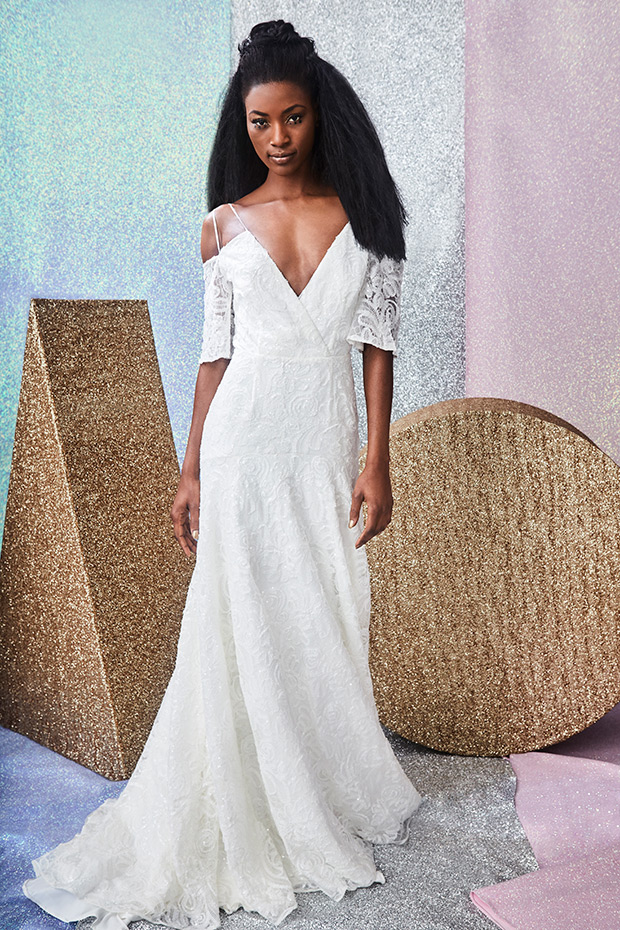 Romer-Charlie-Brear-Mainline-2018-Collection-v-neckline with cut out boho sleeves. Lace detailing on the bodice, free flwoing skirt. To see more visit onefabday.com