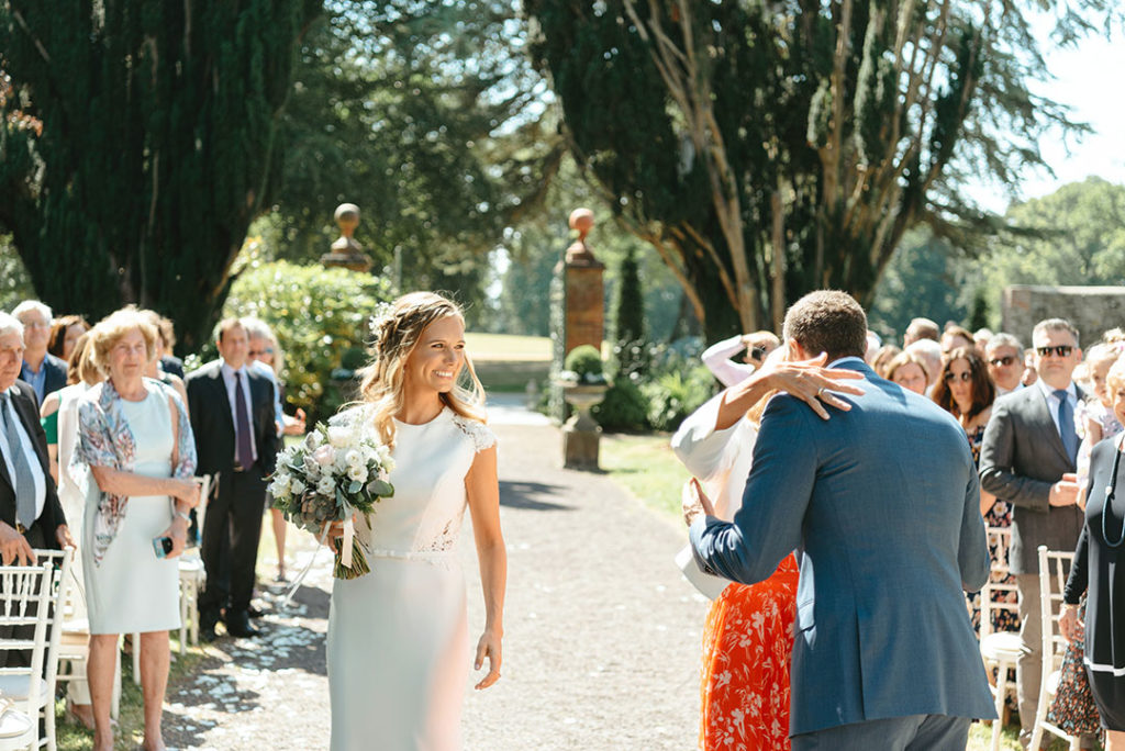 mother walking daughter up the aisle wedding