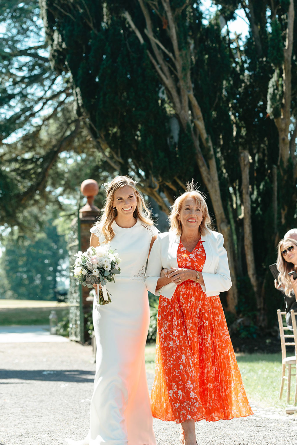 mother walking daughter up the aisle wedding