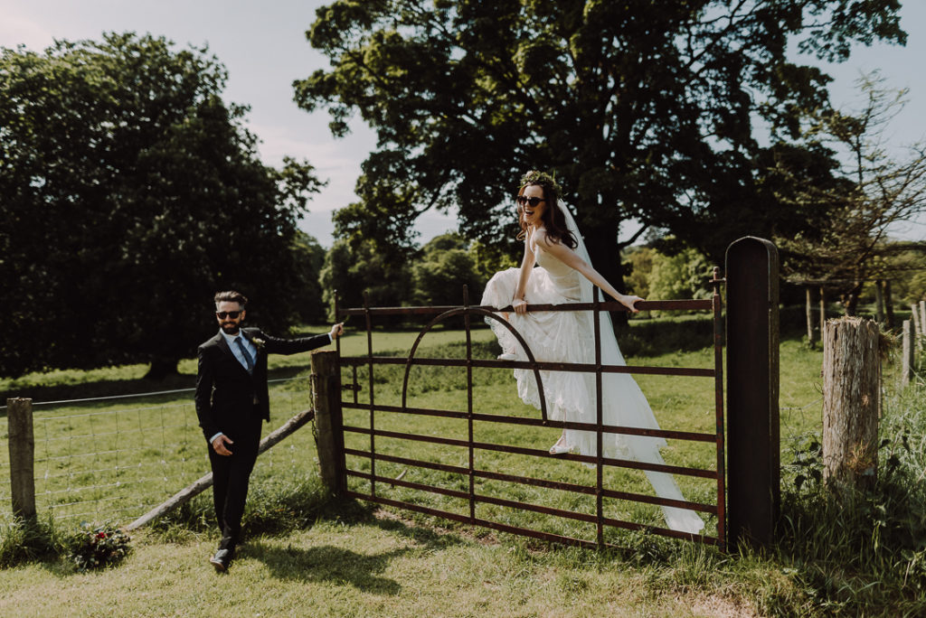 bride and groom wearing sunglasses