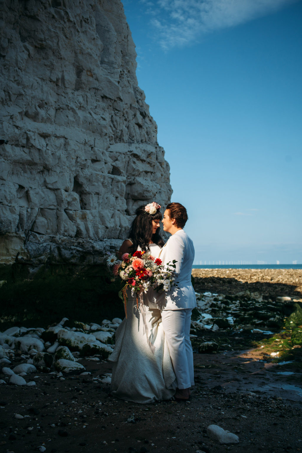 flower crown bride, bridal suit, white wedding suit bride, Beach wedding in Margate UK by Joanna Bongard 