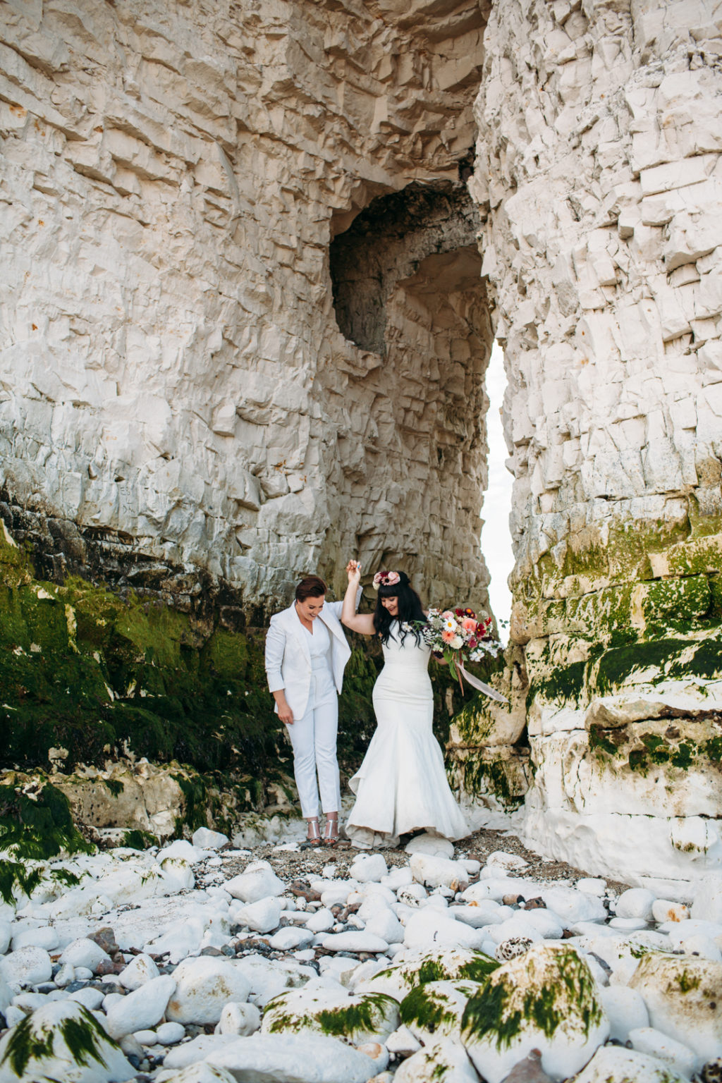 flower crown bride, bridal suit, white wedding suit bride, Beach wedding in Margate UK by Joanna Bongard, oversized floral bouquet