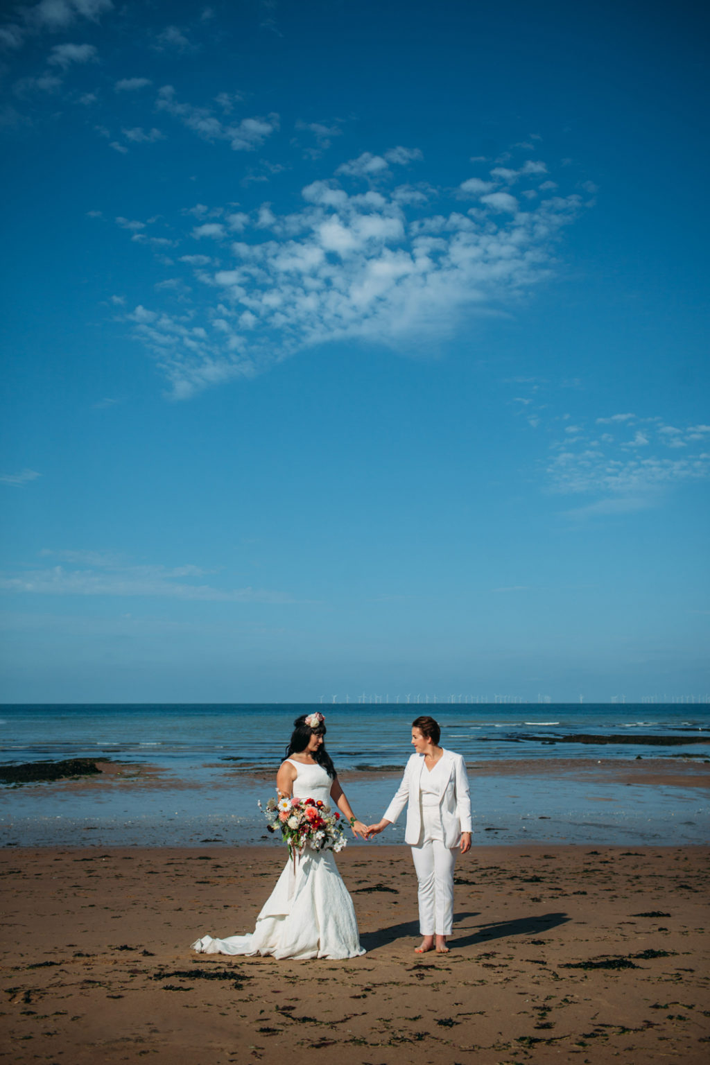 flower crown bride, bridal suit, white wedding suit bride, Beach wedding in Margate UK by Joanna Bongard 