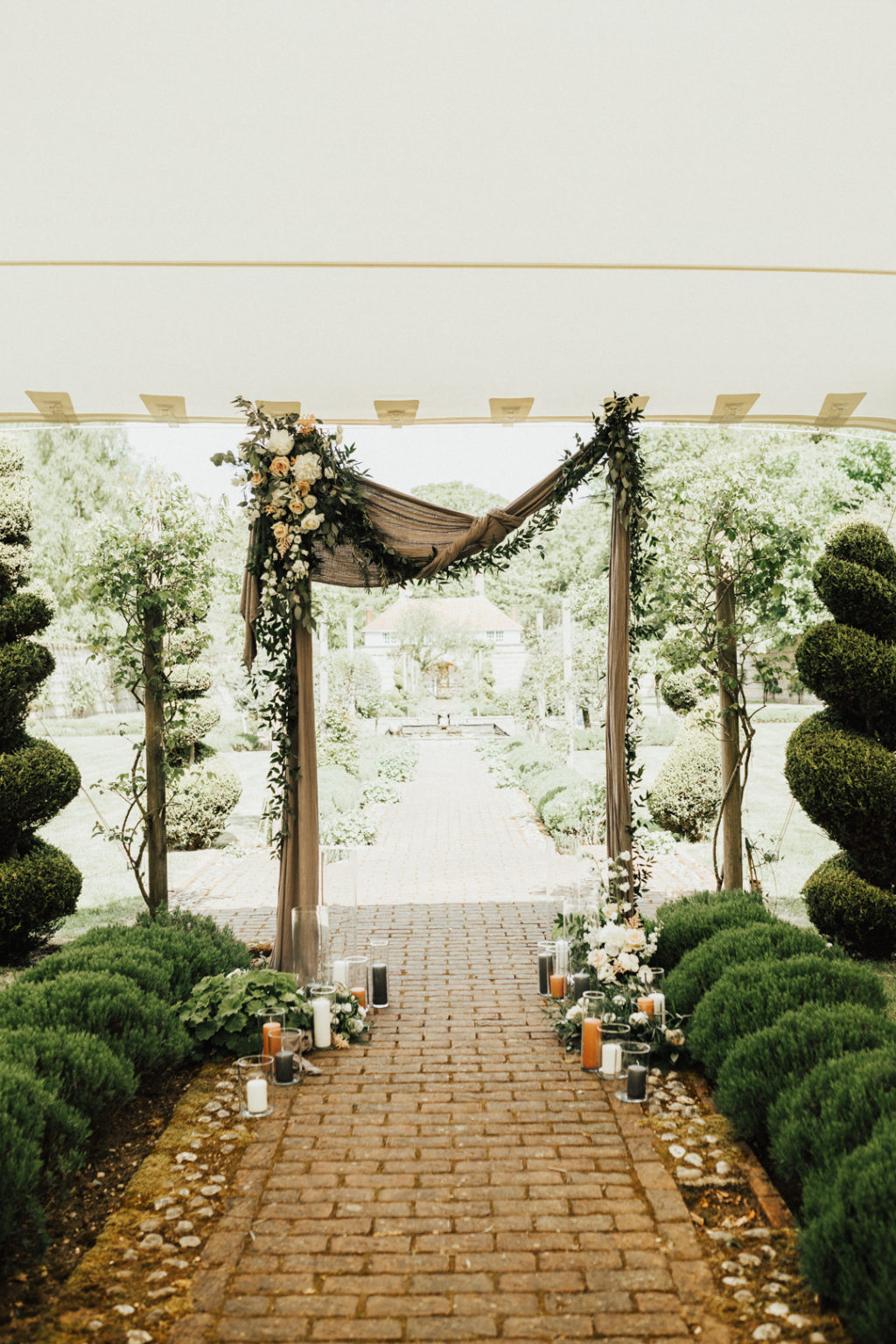 Rustic romantic Voewood Norfolk wedding, naturalistic ceremony backdrop, flower and fabric wedding backdrop