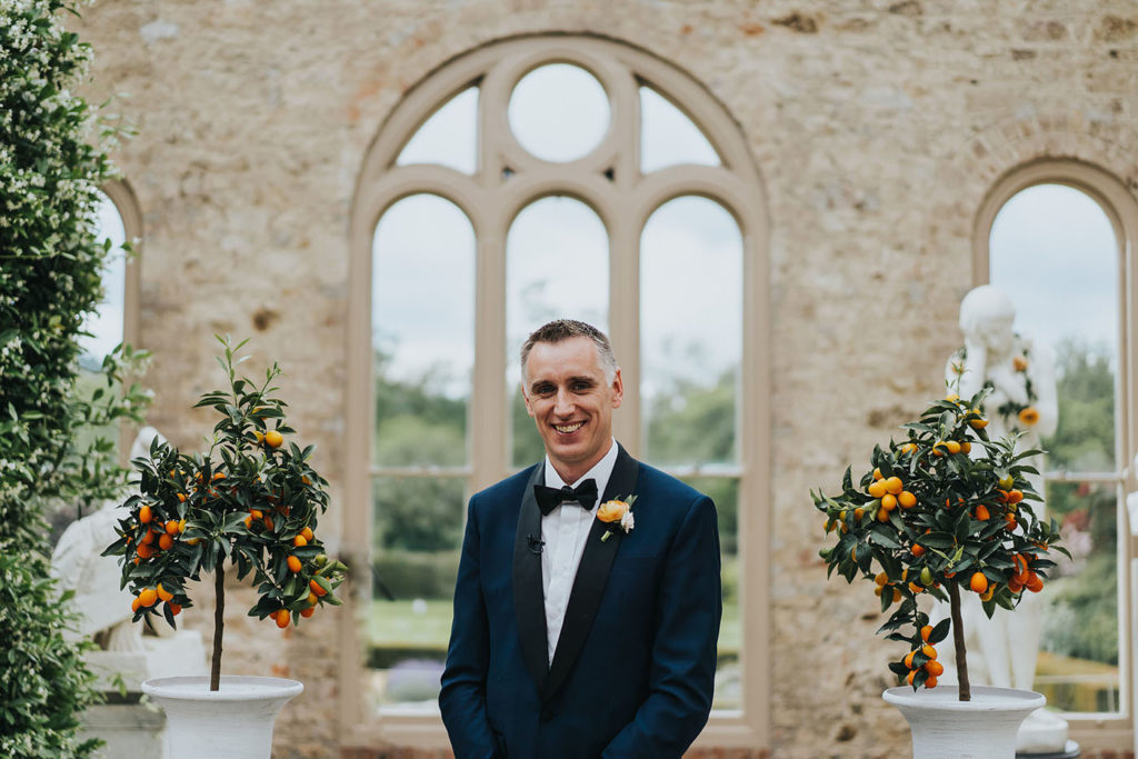 groomswear style, groom's tuxedo, navy tuxedo, romantic first look, Killruddery House and Gardens Grain Store wedding