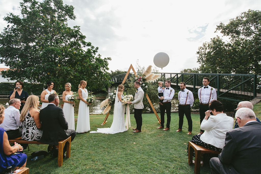 wedding signage, fresh, modern wedding decor, outdoor wedding ceremony, ceremony arch, floral arch, pampas grass arch