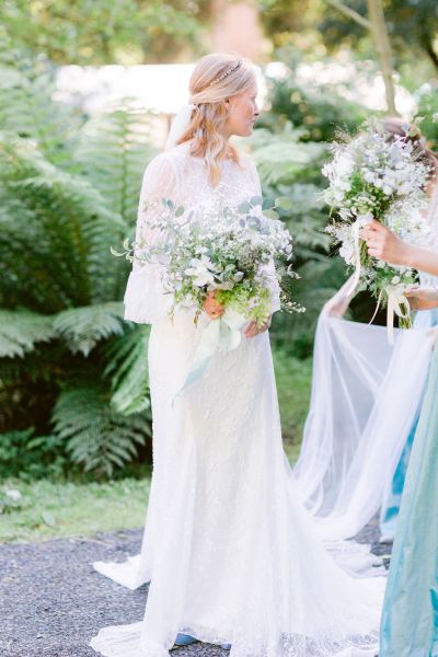 Bride white dress flower bouquet exterior shot