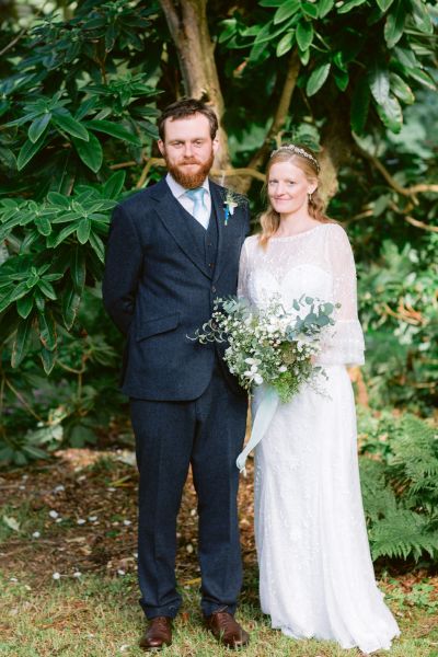 Exterior couple forest green trees bride groom photography