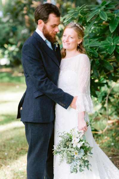 Exterior couple forest green trees bride groom photography holding