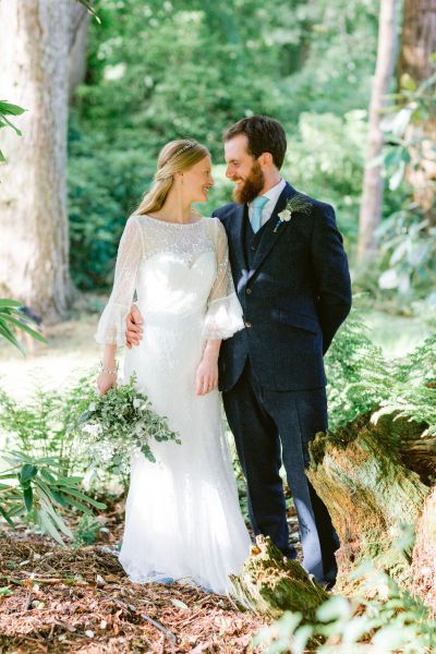 Couple looking at each other forest exterior shot