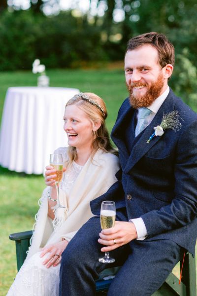 Couple bride and groom champagne prosecco wine smiling