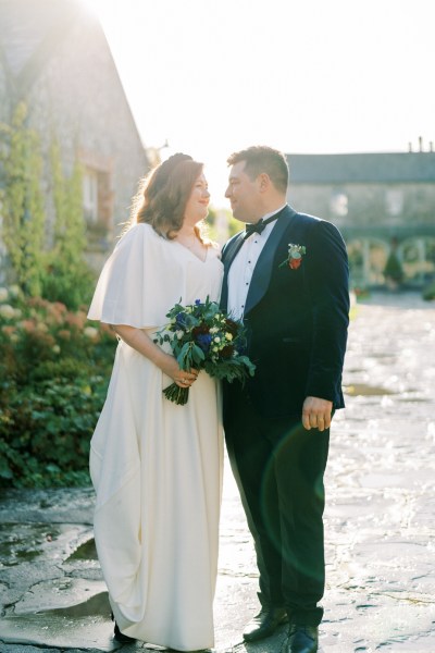 Bride and groom bouquet of flowers looking at each other love