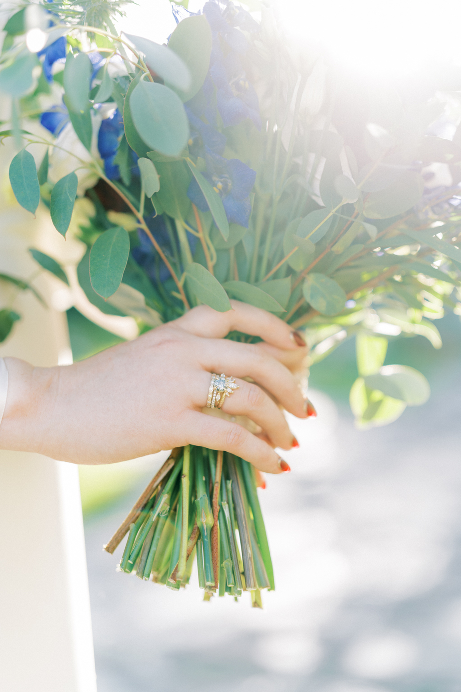 Bride holding bouquet of flowers up close wedding ring