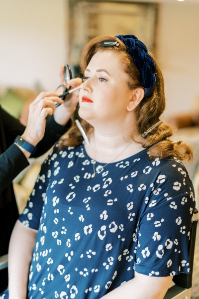 Bride getting ready before ceremony wedding makeup MUA