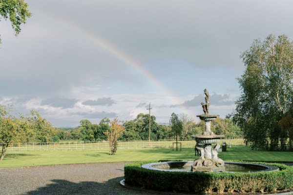 Rainbow garden fountain forest greenery exterior shot