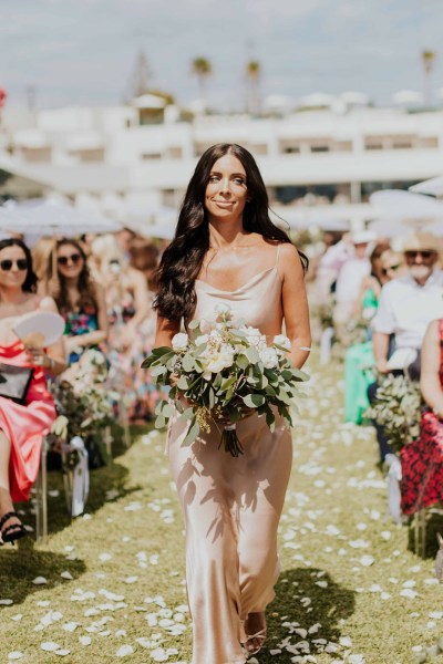 bridesmaid walking down aisle