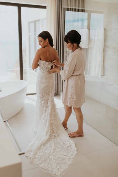 bride getting ready with mom