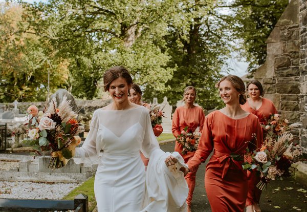 bride and orange bridesmaids